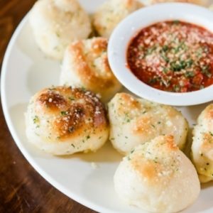 Garlic knots with marinara dipping sauce at Jonny's Pizza in Aubrey and Frisco, TX